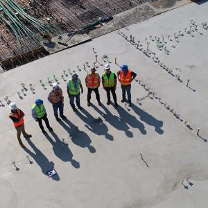 Builders Brisbane | Men in high vis safety gear on a construction siteMen in high vis safety gear on a construction site